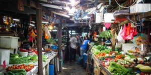 Fresh fruit and vegetables being sold on Malaysian market stalls