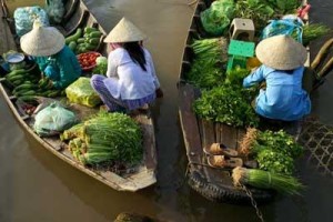 Food vendors selling fresh herbs and vegetables on the river